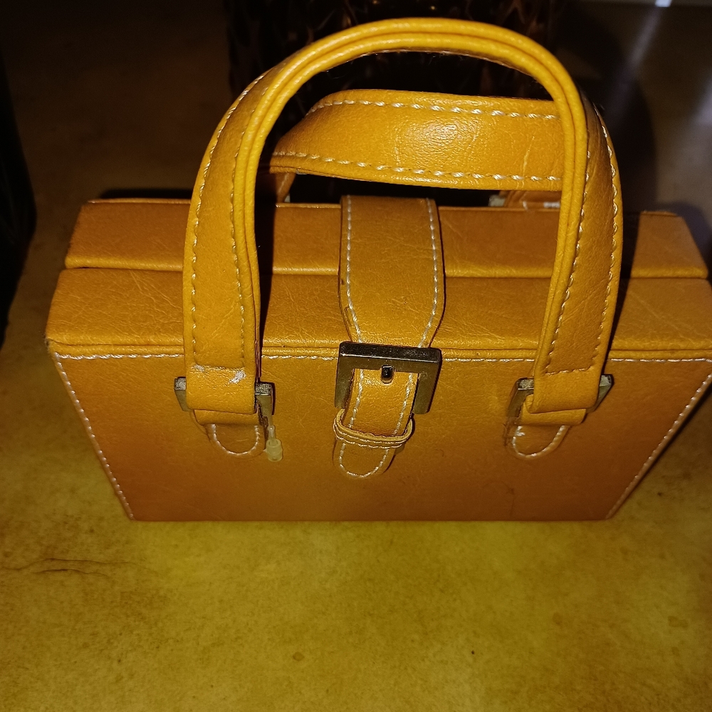 Ladies tan mini purse.